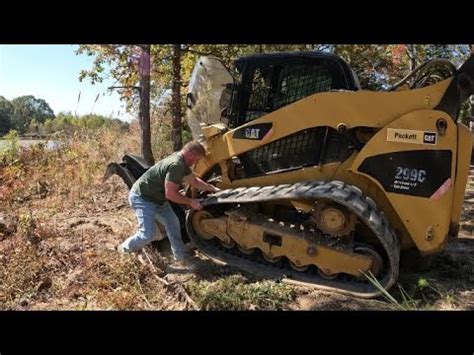 how to put a track back on a skid steer|skid steer track came off.